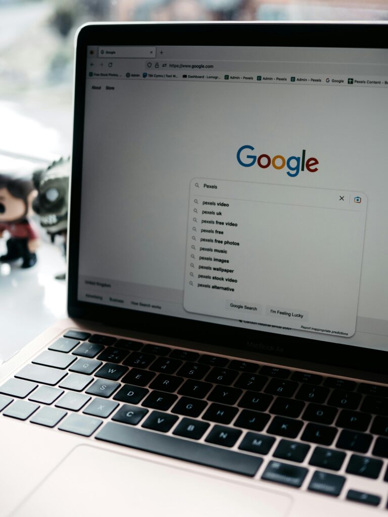 pexels-photo-16368540-16368540 A close-up shot of a laptop displaying a Google search page with related searches visible.